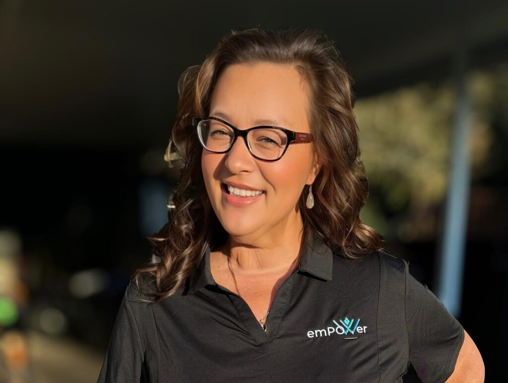 Tammy Davis wearing emPower Polo Shirt